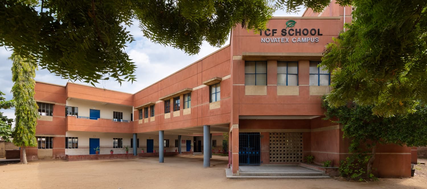 A quiet courtyard before the morning bell at the Novatex Campus in Bin Qasim Town, Karachi